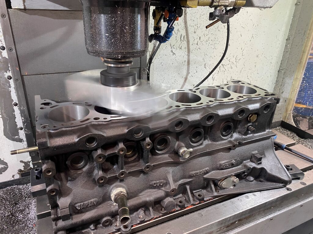 Nissan RB26 block being surfaced after liners were fitted.