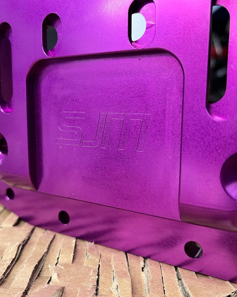 Close up on the RB26 block brace with the specj motorsport logo engraved into it