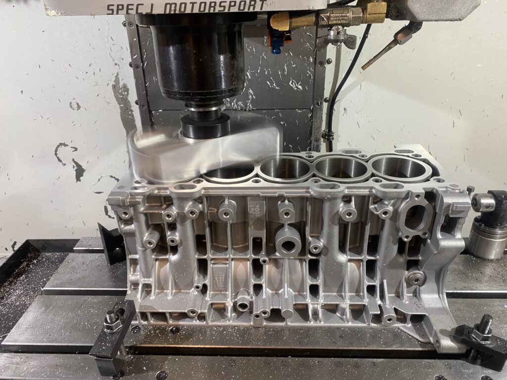 Ford Focus ST/Volvo T5 2.5l cylinder block being surfaced after liner fitting.